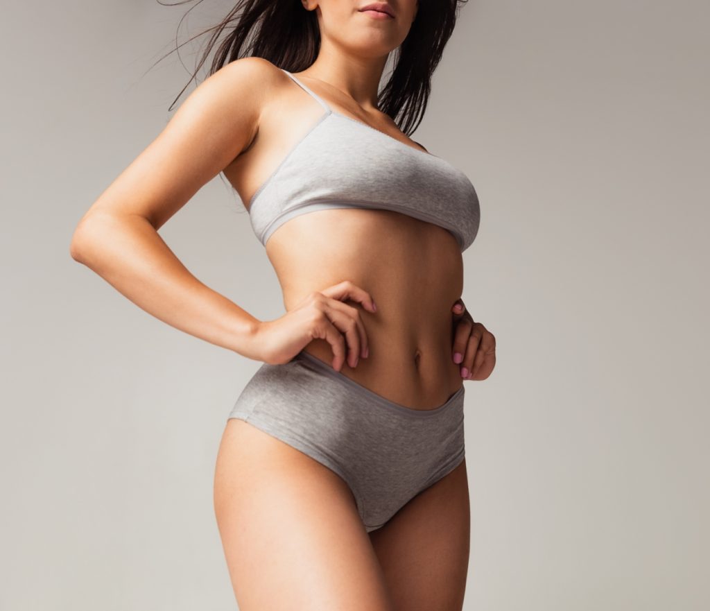 Woman in grey sports bra and underwear