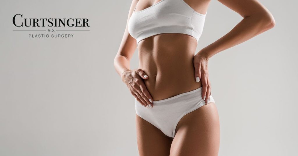 Woman with flat abdomen after tummy tuck. (Model)