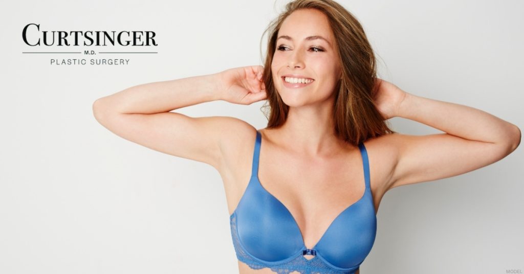 Women showcasing breast augmentation results (model)