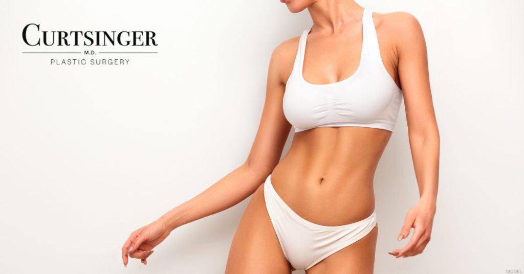 Women showcasing tummy tuck results (model)
