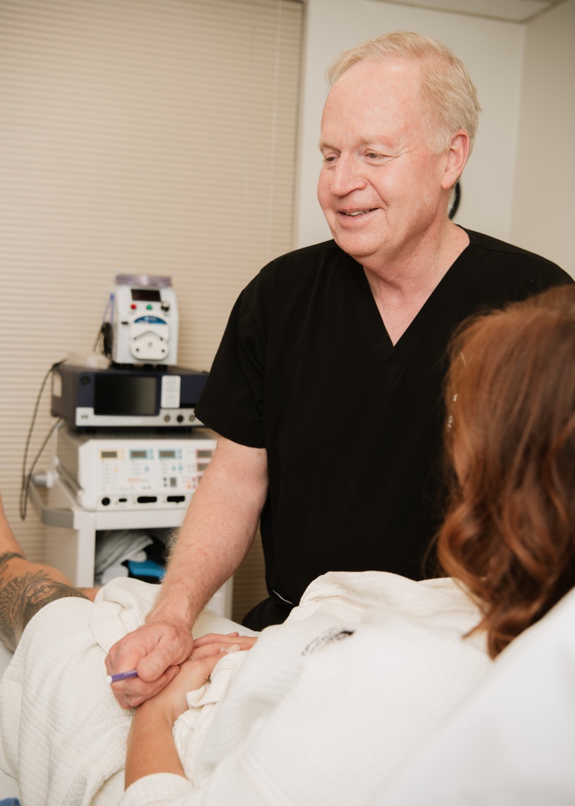 Dr. Curtsinger meeting with patient